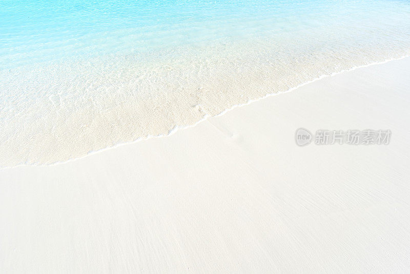 Soft wave of clear turquoise sea and beach sand copy space scene